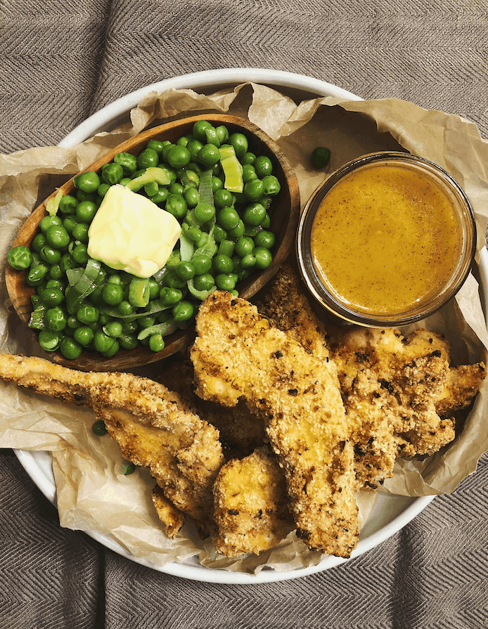 Almond Crusted Baked Chicken Tenders with Honey Chipotle Mustard and Buttery Leeks and Peas