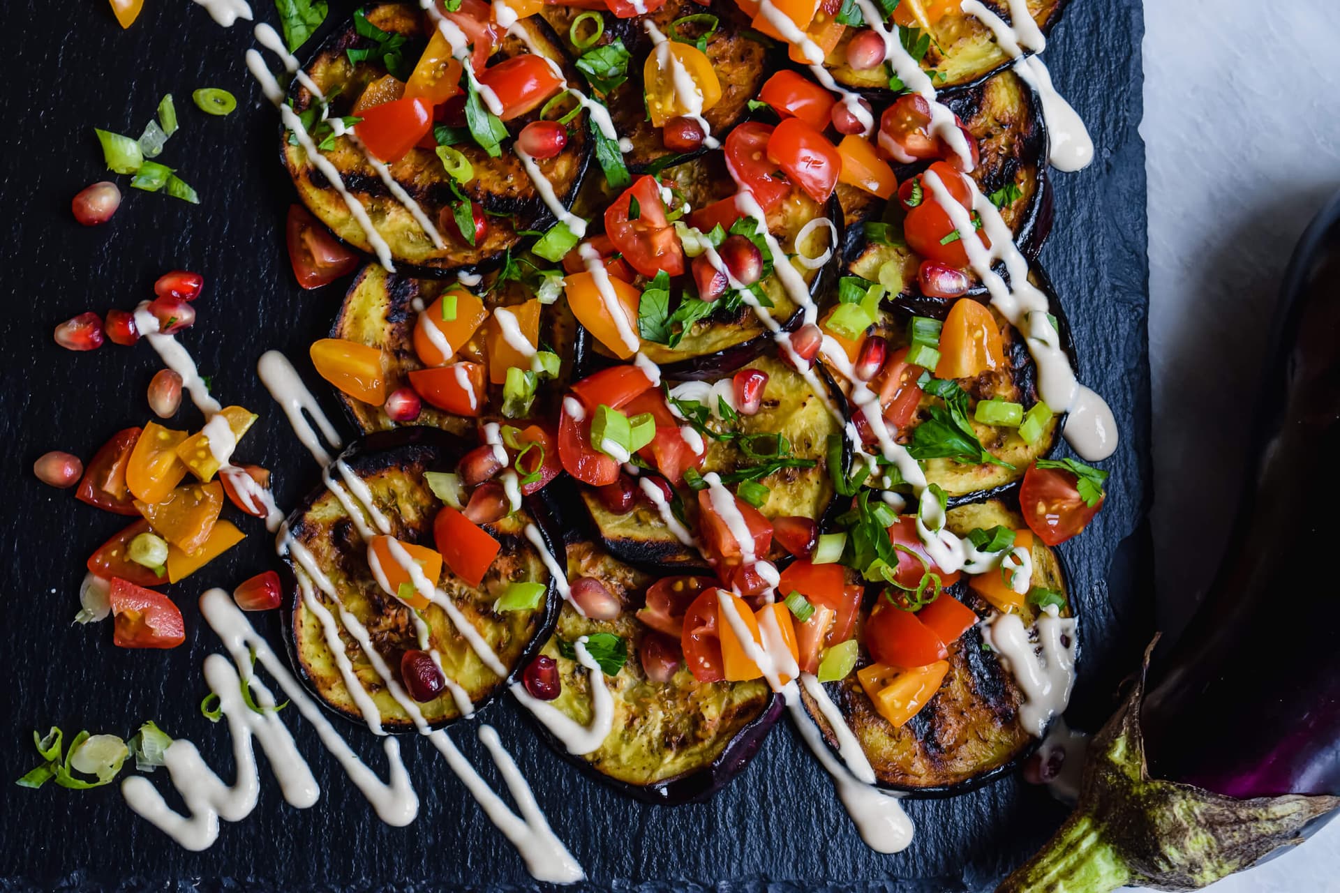 Perfect Grilled Eggplant Rounds with Tahini, Chopped Tomato and Pomegranate