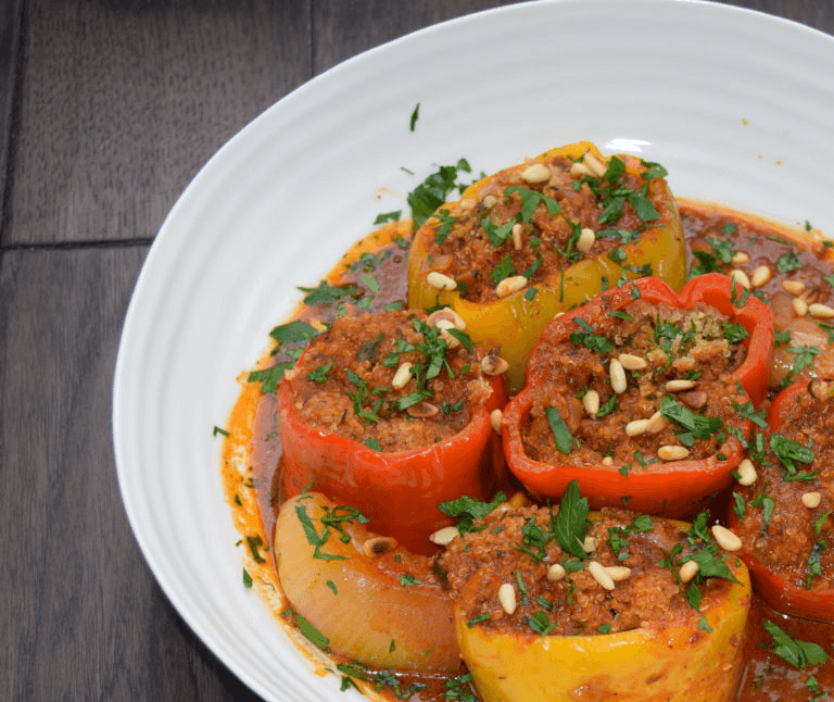 Braised Stuffed Peppers with Quinoa, Zucchini, Tomatoes and Pine Nuts